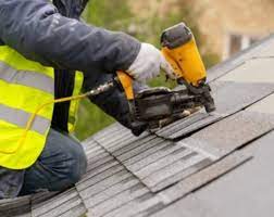 roofer with nail gun