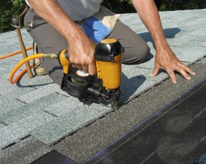 roofing contractor with nail gun